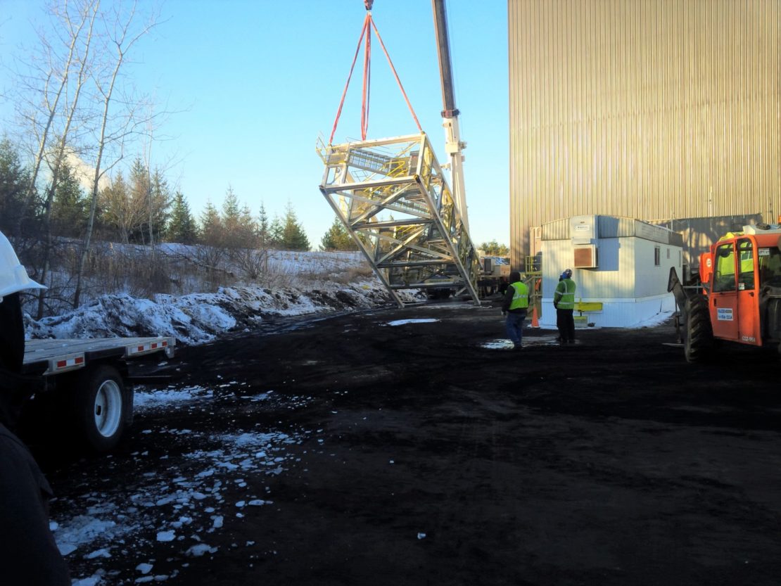 Lifting staircase into place for REF Equipment Relocation