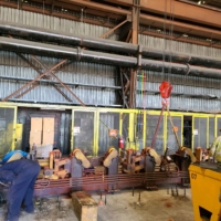 CCI Industrial Constructors - Workers in an industrial setting with heavy equipment and a possible maintenance or construction activity underway.