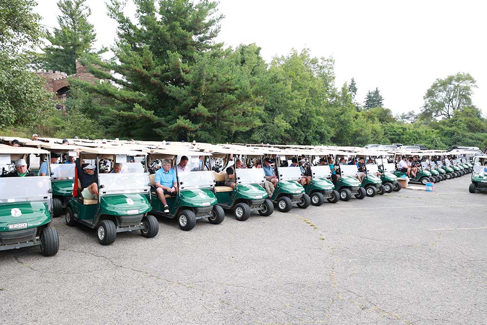CCI Industrial Constructors - A lineup of golf carts filled with players, ready to embark on a golf course adventure.