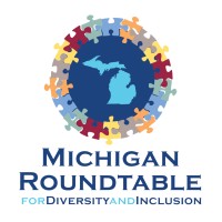 CCI Industrial Constructors - Michigan roundtable emblem featuring a globe surrounded by a colorful ring of interconnected jigsaw puzzle pieces, symbolizing diversity and inclusion.